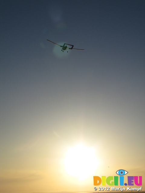 SX22365 RC plane flying into sunset